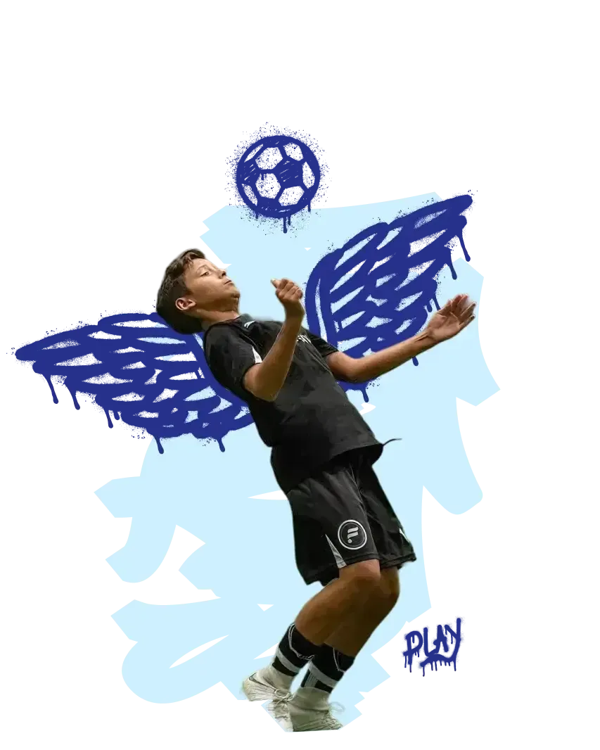 A camper striking the ball during an indoor summer camp session