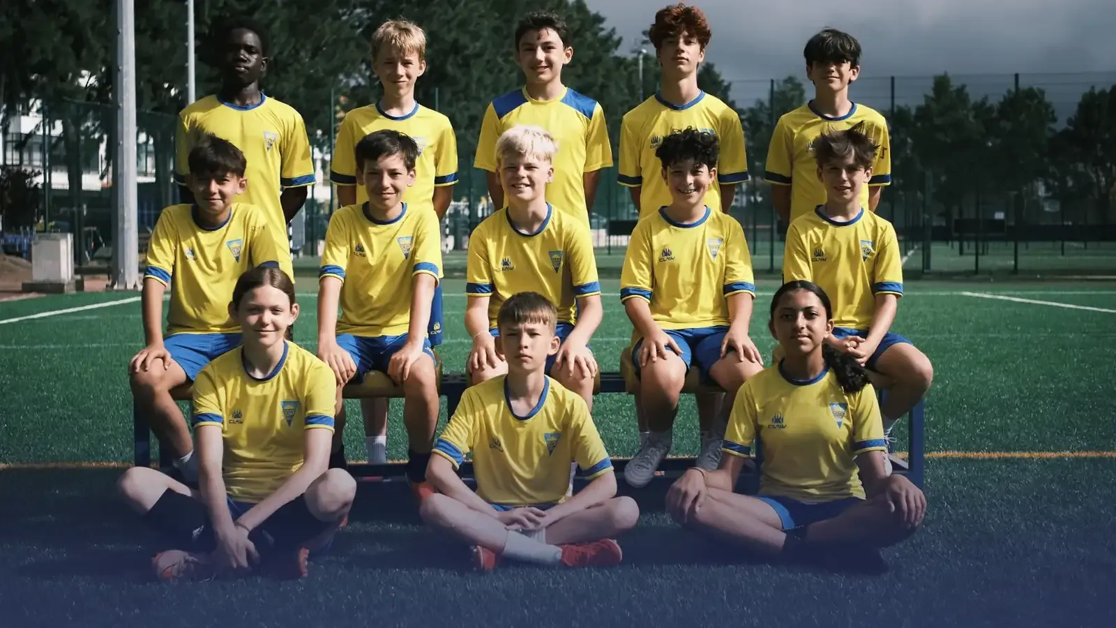 Own Touch travel squad together on an outdoor pitch