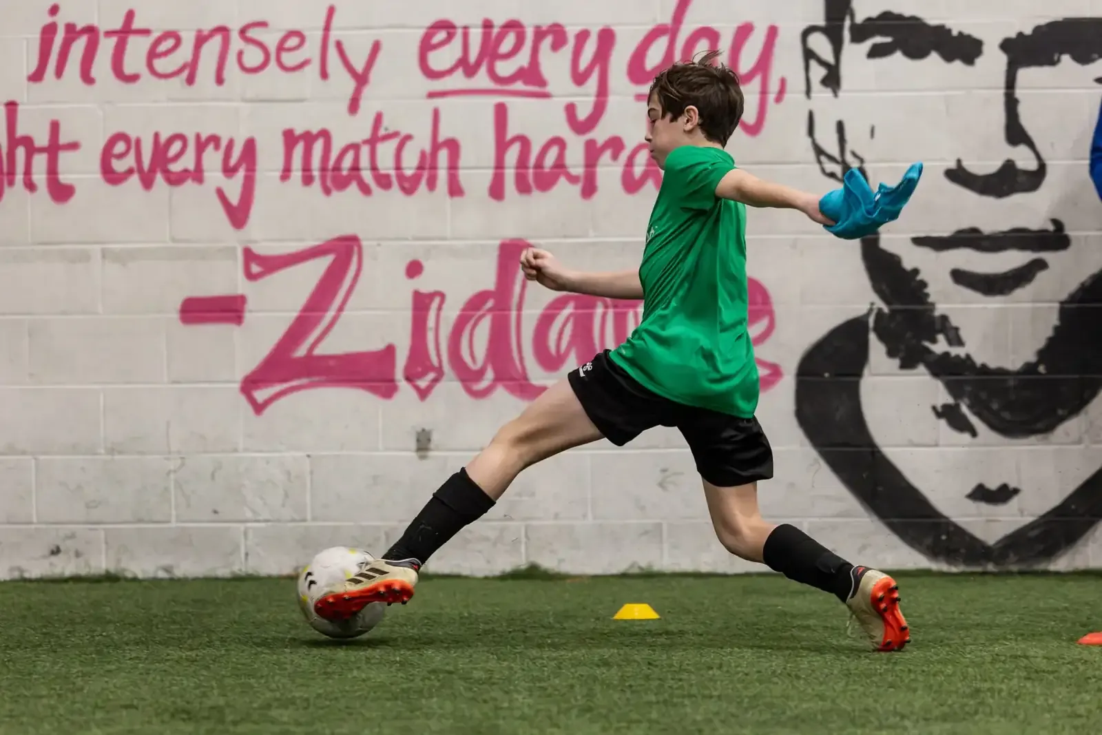 A player finishing on goal during a high-level training session