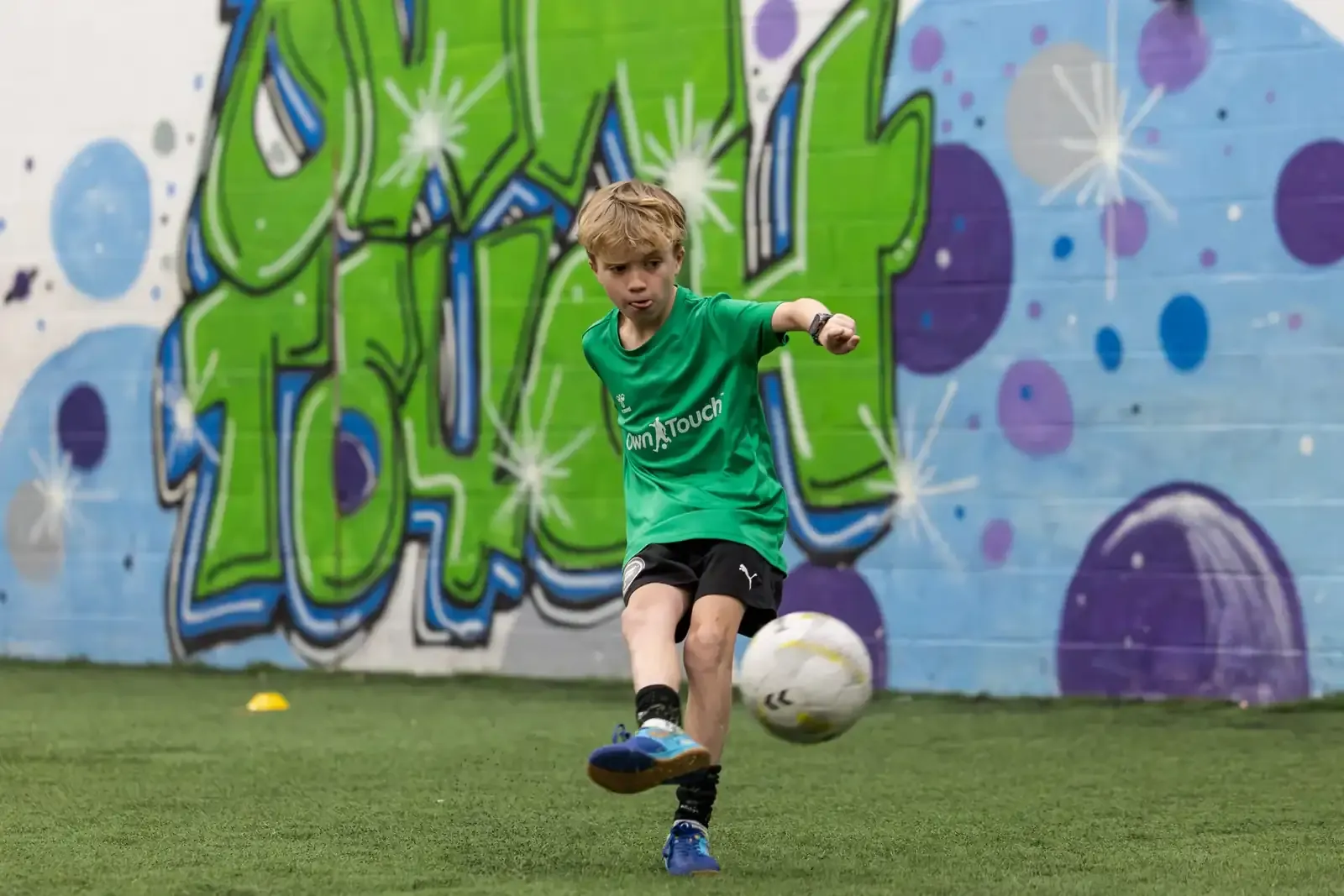 Player striking the ball during a private session in the Own Touch studio